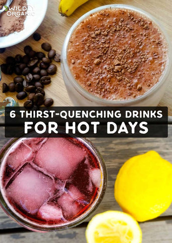 Two refreshing drinks with ice, coffee beans, and lemons on a wooden surface.