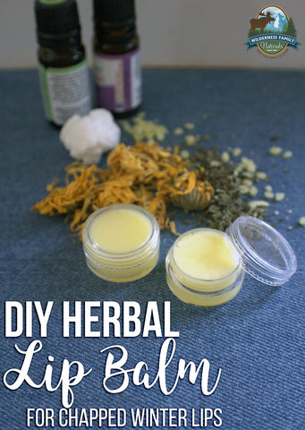 DIY herbal lip balm displayed with ingredients on a blue surface, labeled for chapped winter lips