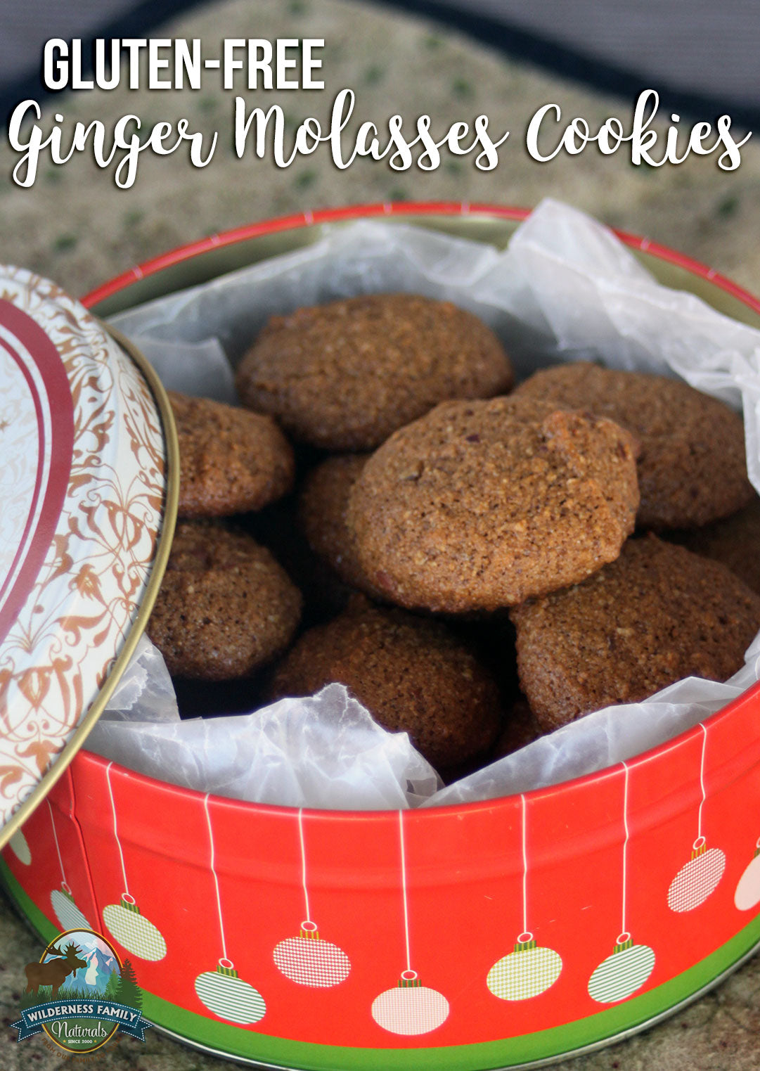 Tin of gluten-free ginger molasses cookies, featuring a classic, rich flavor perfect for sweet treats.