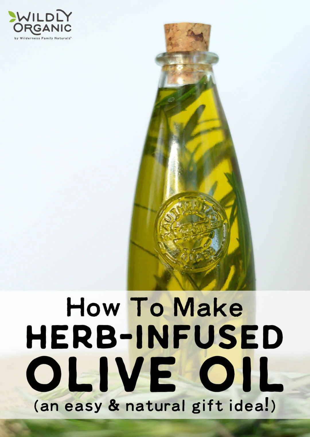 A bottle filled with olive oil and fresh rosemary, sealed with a cork, with a label at the bottom, placed on a neutral background.
