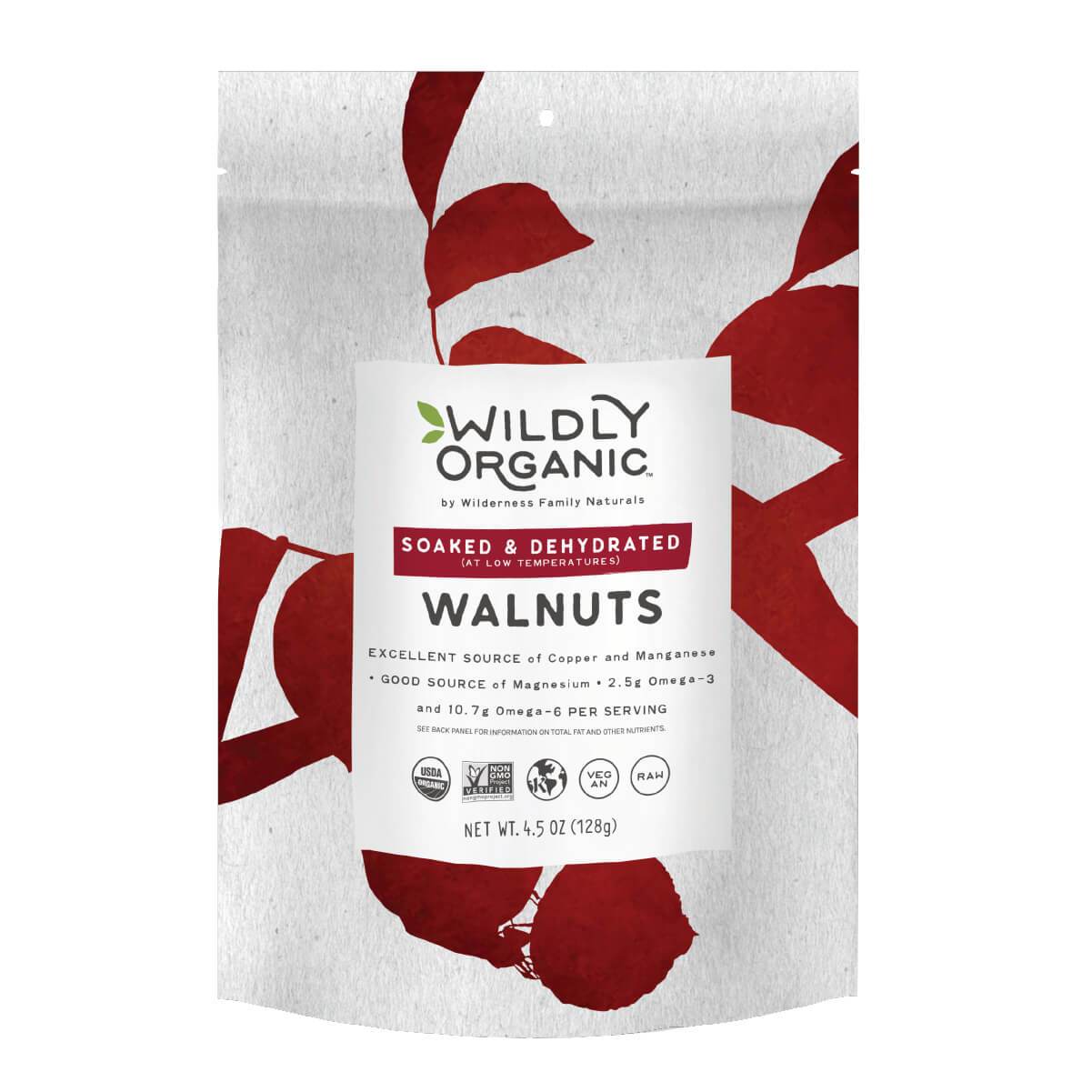 A bag of Wildly Organic walnuts with red leaf design on the background