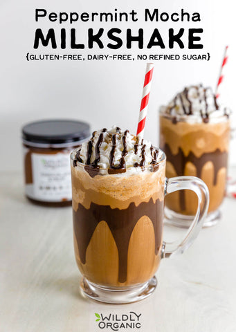 Two peppermint mocha milkshakes with whipped cream and drizzle, labeled gluten-free and dairy-free