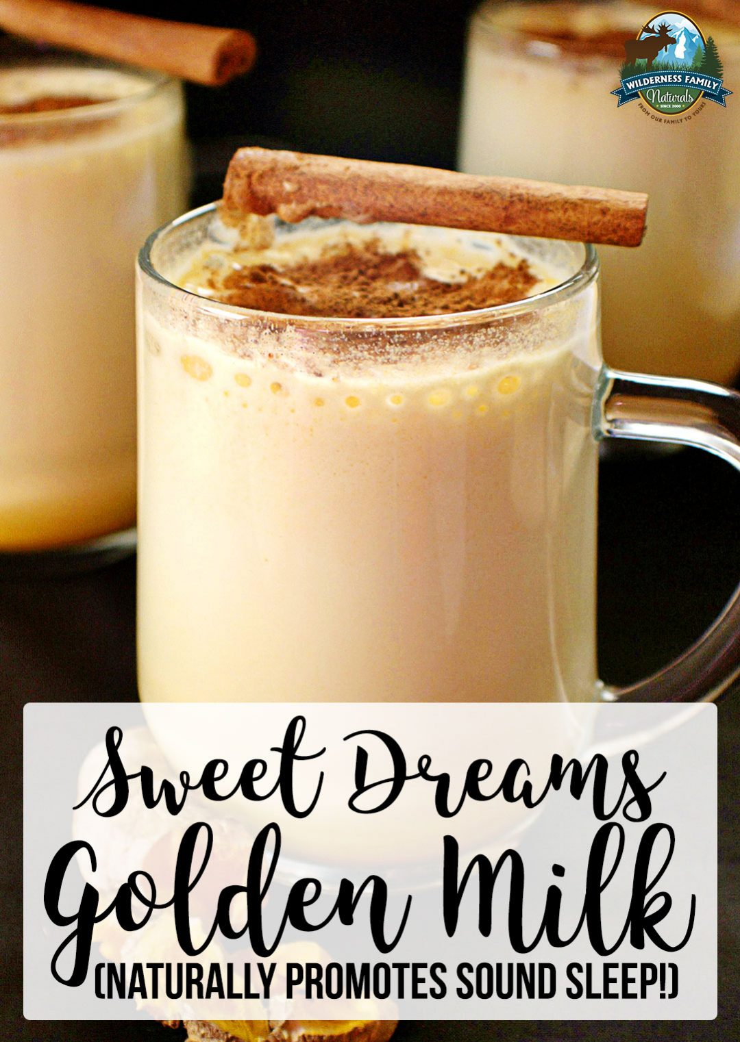 A handled glass mug containing creamy beverage with a stick of cinnamon on top